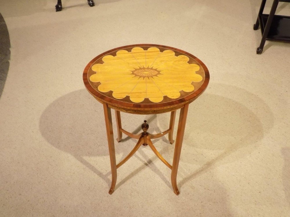 A satinwood inlaid Edwardian Period oval occasional table.