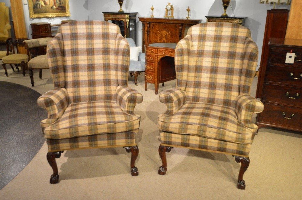 A fine pair of George III Style wing armchairs upholstered in Moon wool fabric
