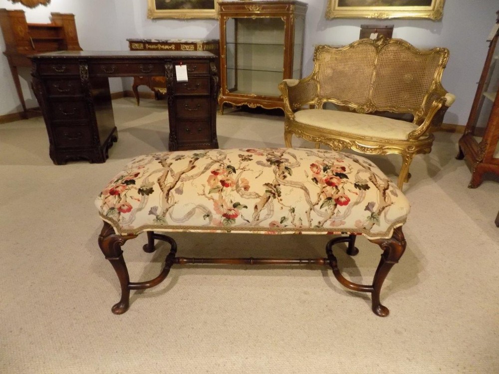 A walnut George I Style antique stool.