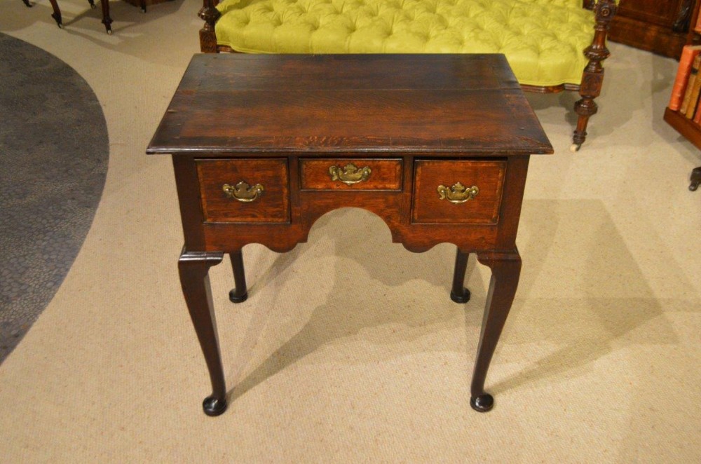 An oak George III Period antique lowboy