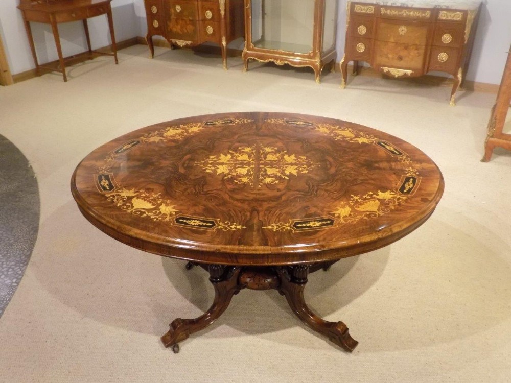 A burr walnut & marquetry inlaid Victorian Period antique loo/dining table