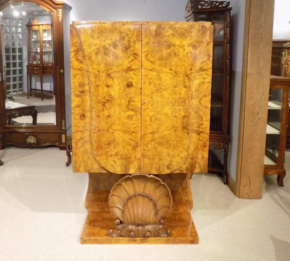 A Stunning quality burr walnut Art Deco Period cocktail cabinet by Hille & Co of London.