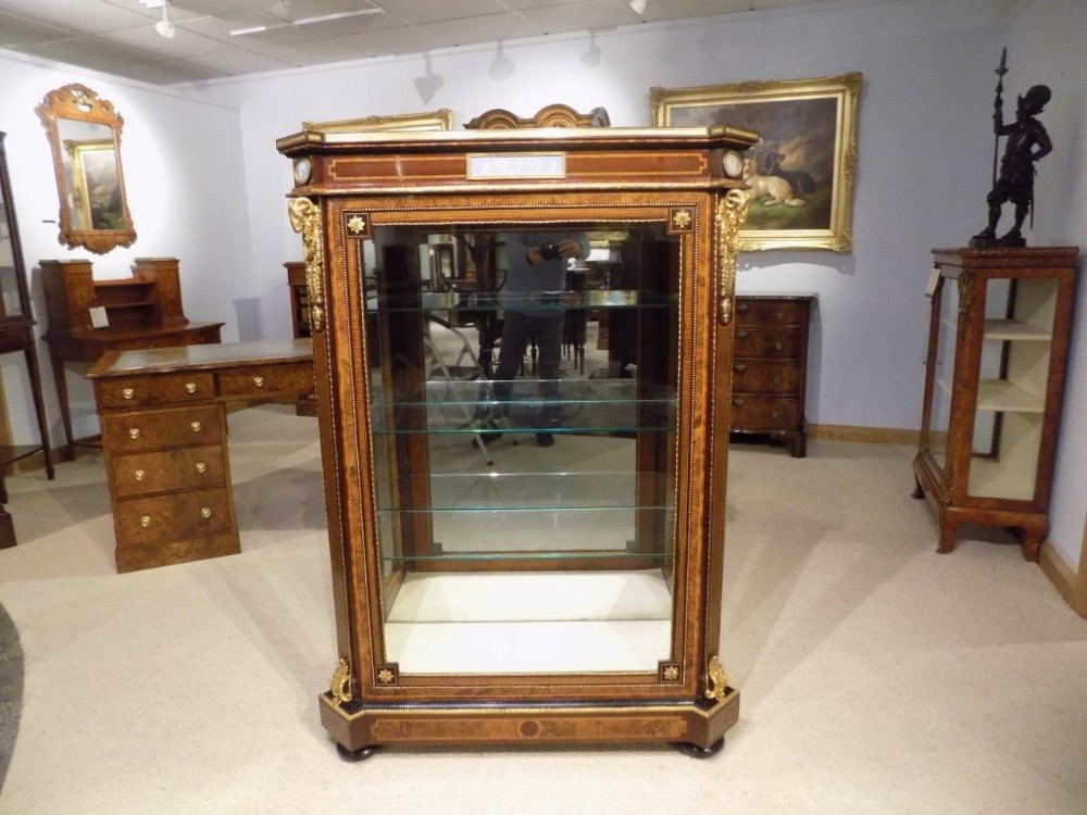 A 19th Century exhibition quality burr walnut, purple heart and kingwood ormolu mounted antique pier cabinet.