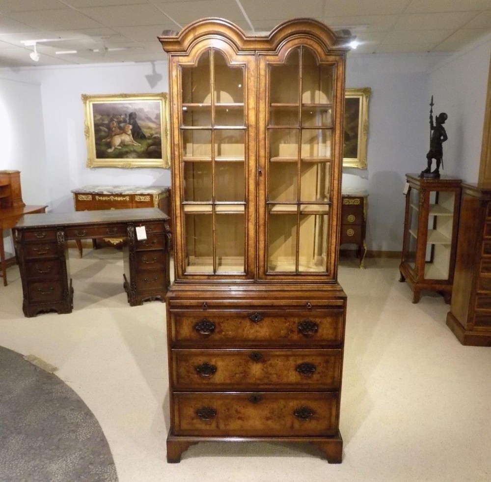 A beautiful walnut Queen Anne Style double domed cabinet on chest