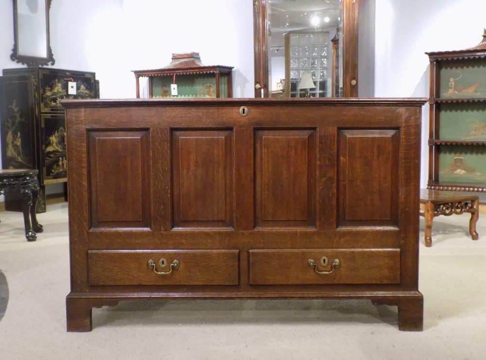 An oak Late 18th Century English four panel mule chest.