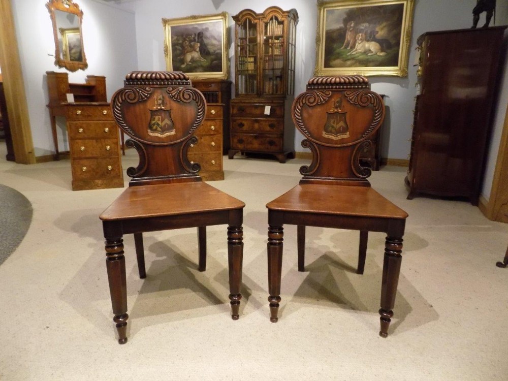 A good pair of mahogany William IV Period antique hall chairs