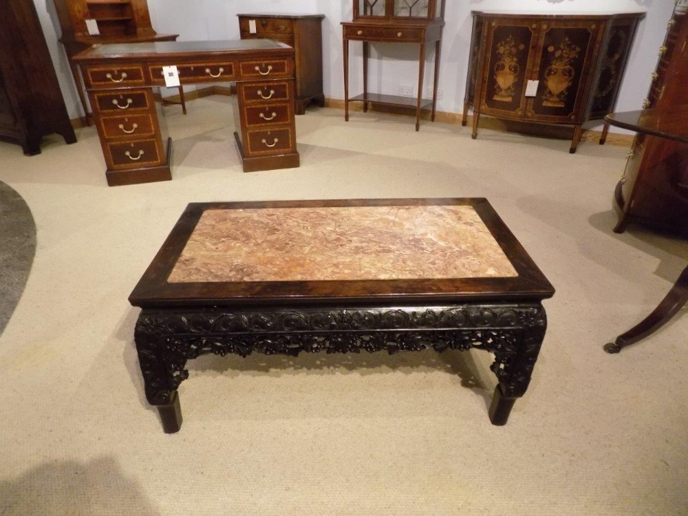 A carved hardwood & marble inset  antique Chinese coffee table