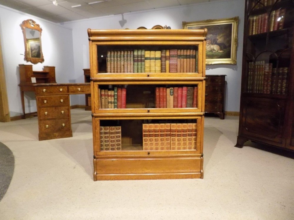 An oak Edwardian three stacking bookcase by Globe Wernicke