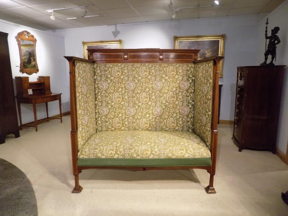 A mahogany inlaid Edwardian Period antique love seat