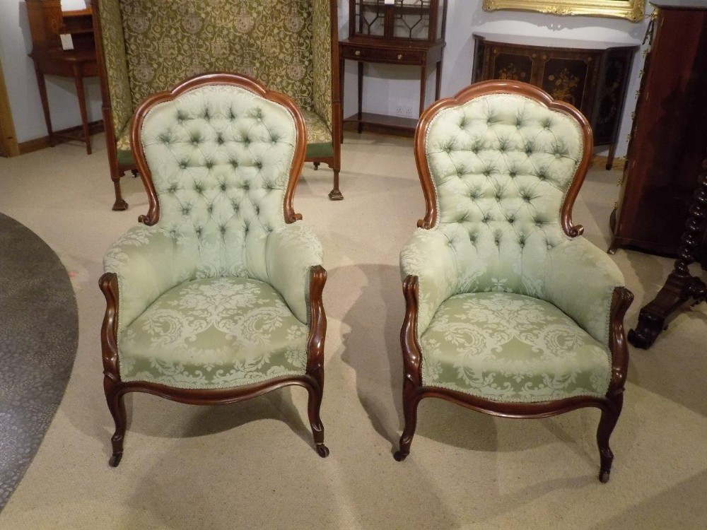 A good pair of mahogany Victorian Period antique armchairs. 