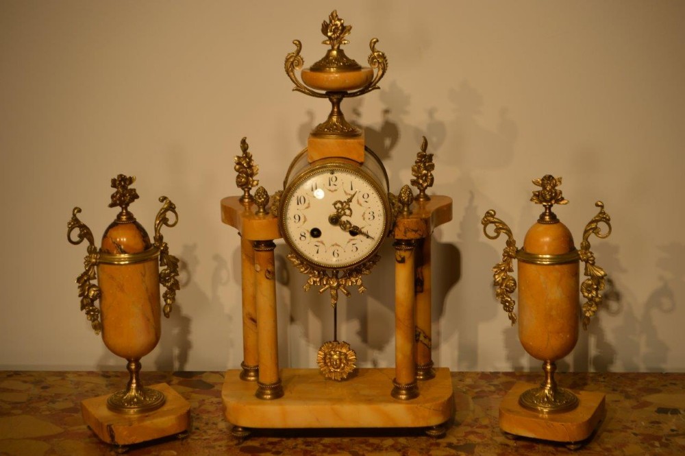 A French Sienna Marble & Ormolu mounted antique clock set.