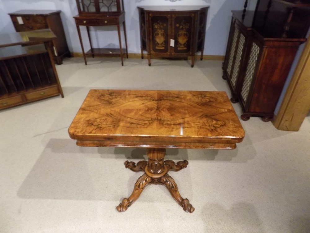 A burr walnut Victorian Period antique card table.