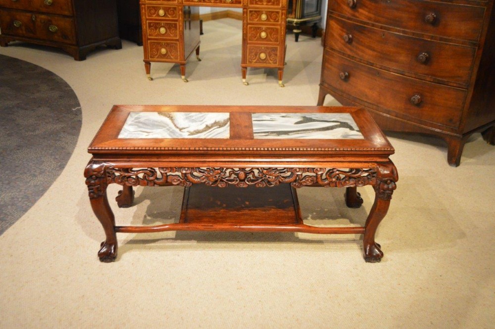 A Chinese hardwood marble inset coffee table