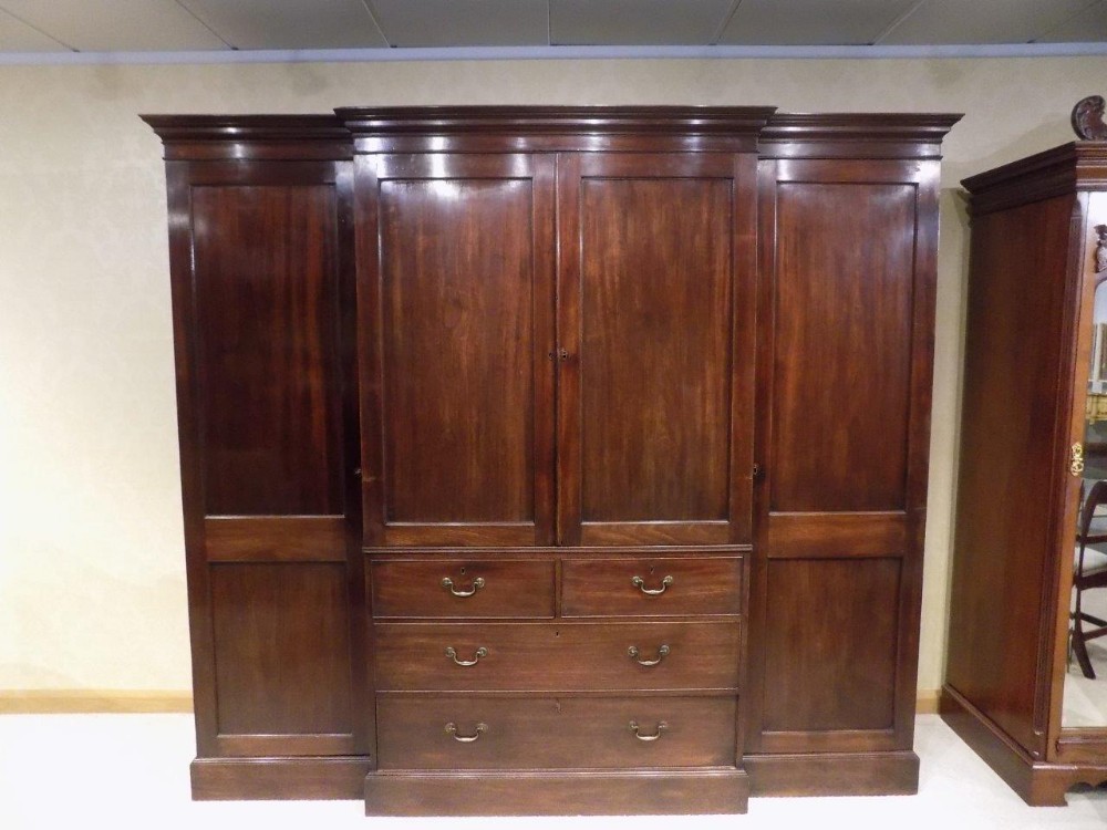 A mahogany Late Georgian Period breakfront wardrobe by Gillows of Lancaster. 