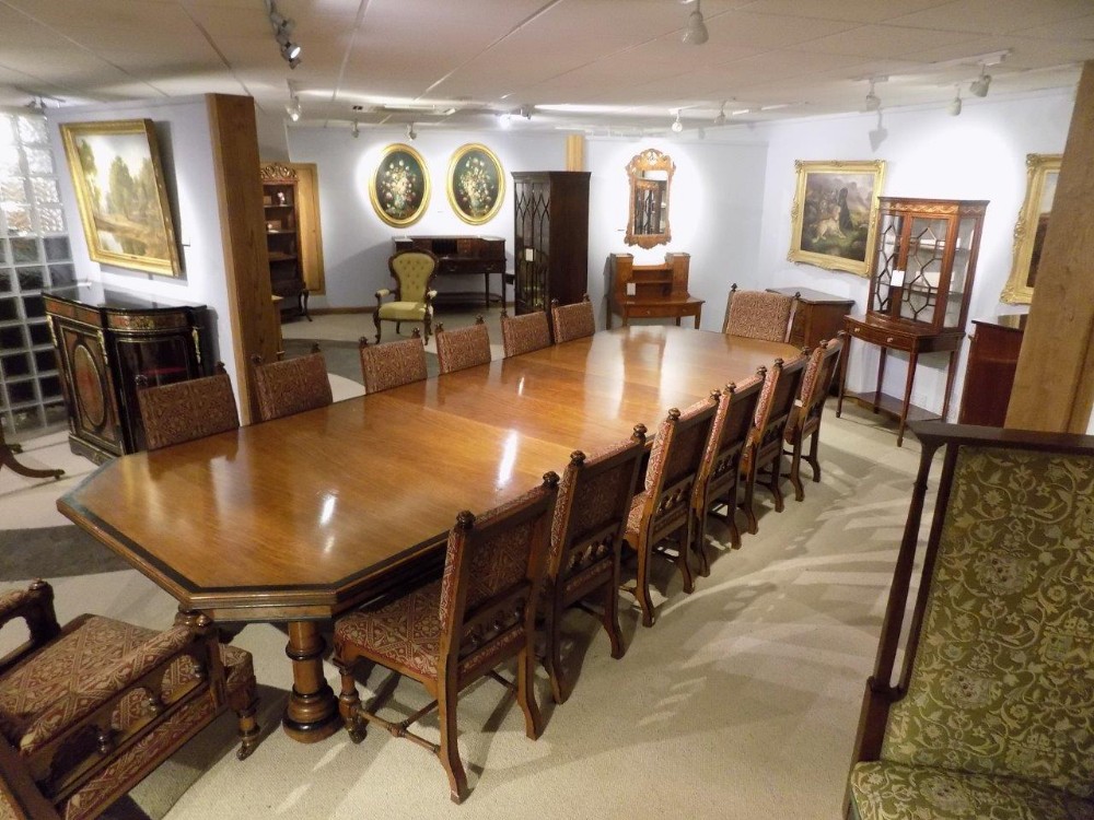 A fantastic & rare Pollard oak and ebony dining room table with 14 matching chairs