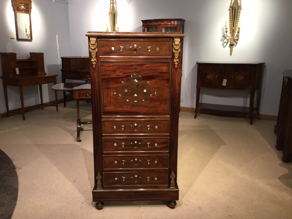 A 19th Century French Mahogany, brass and mother of pearl inlaid secretaire abattant.