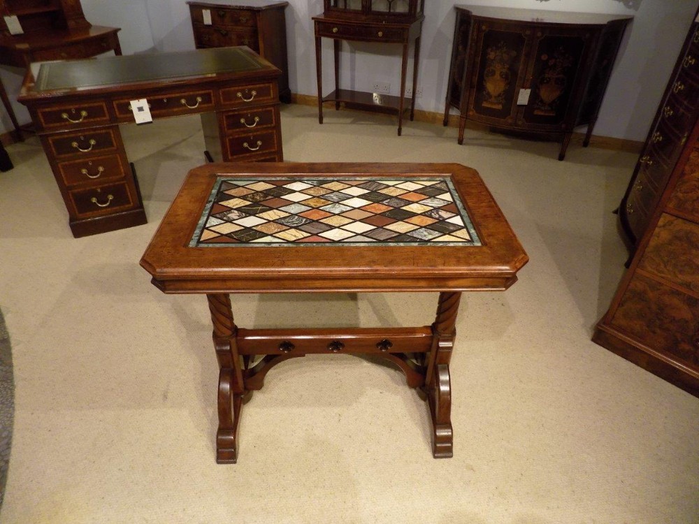 A mahogany  Early Victorian Period Gothic Revival library table with specimen marble top
