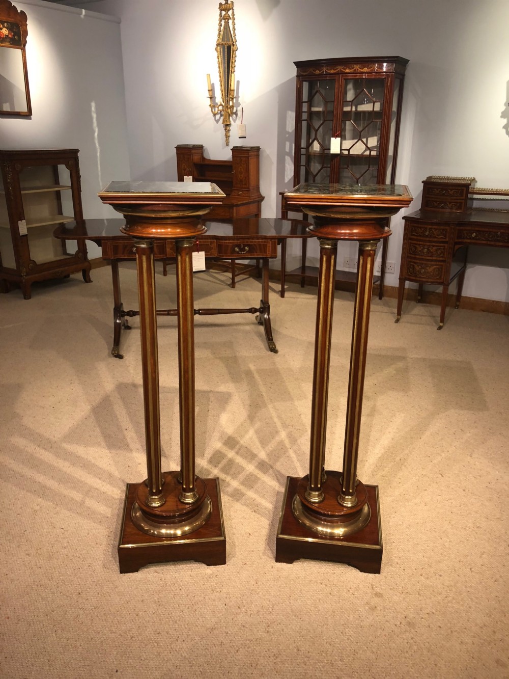 A fine quality pair of mahogany brass mounted and gilded Late Victorian Period pedestals.