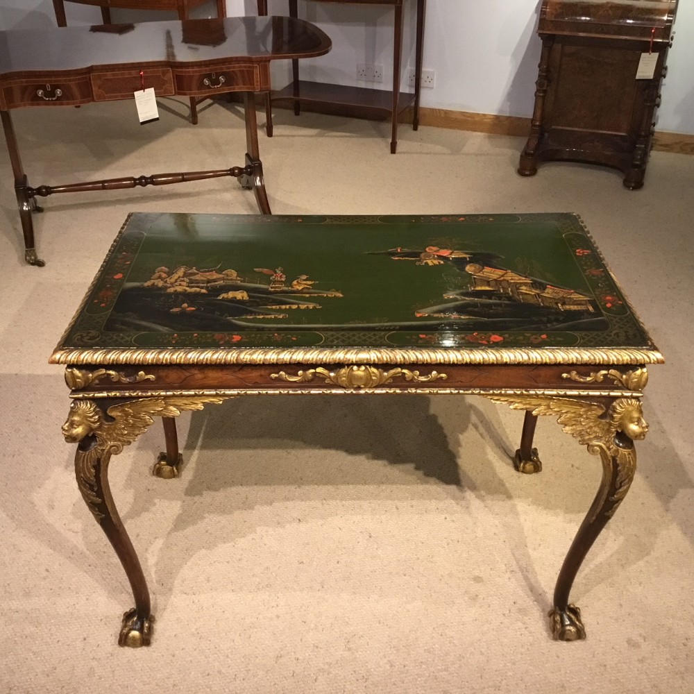 A Walnut and chinoiserie George II Style centre table
