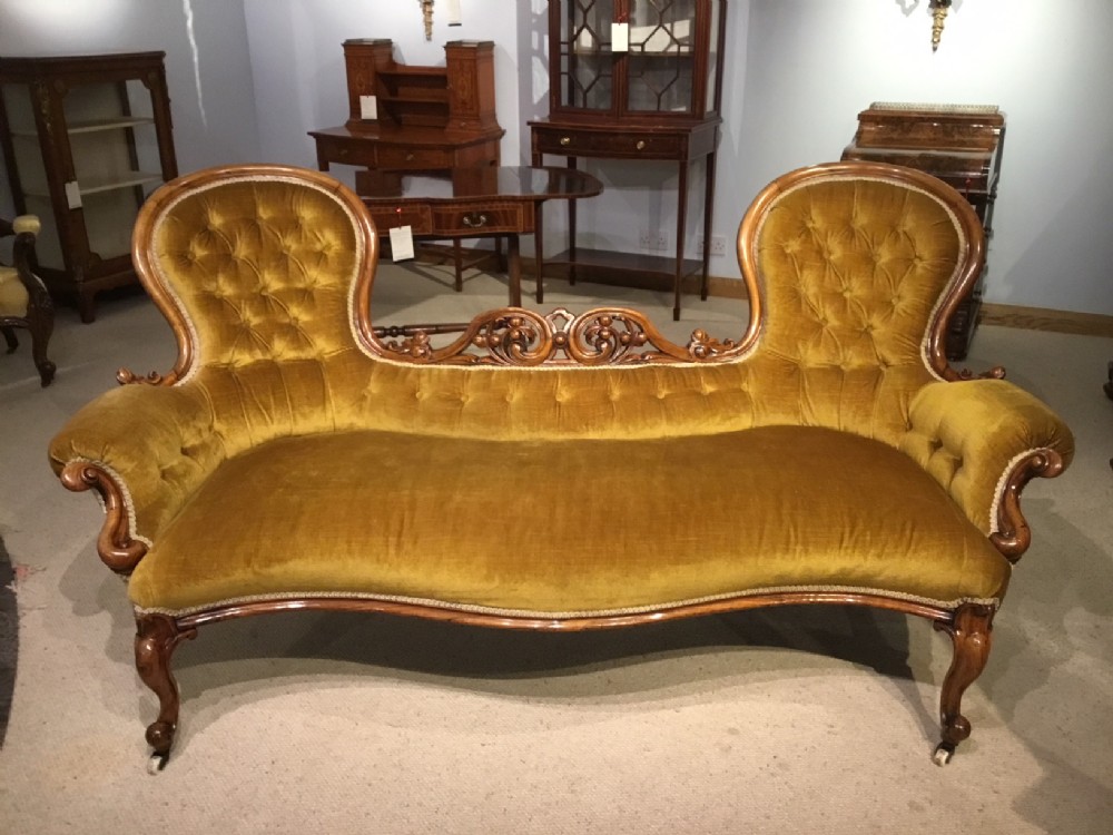 A walnut Victorian Period Carved double end antique chaise longue