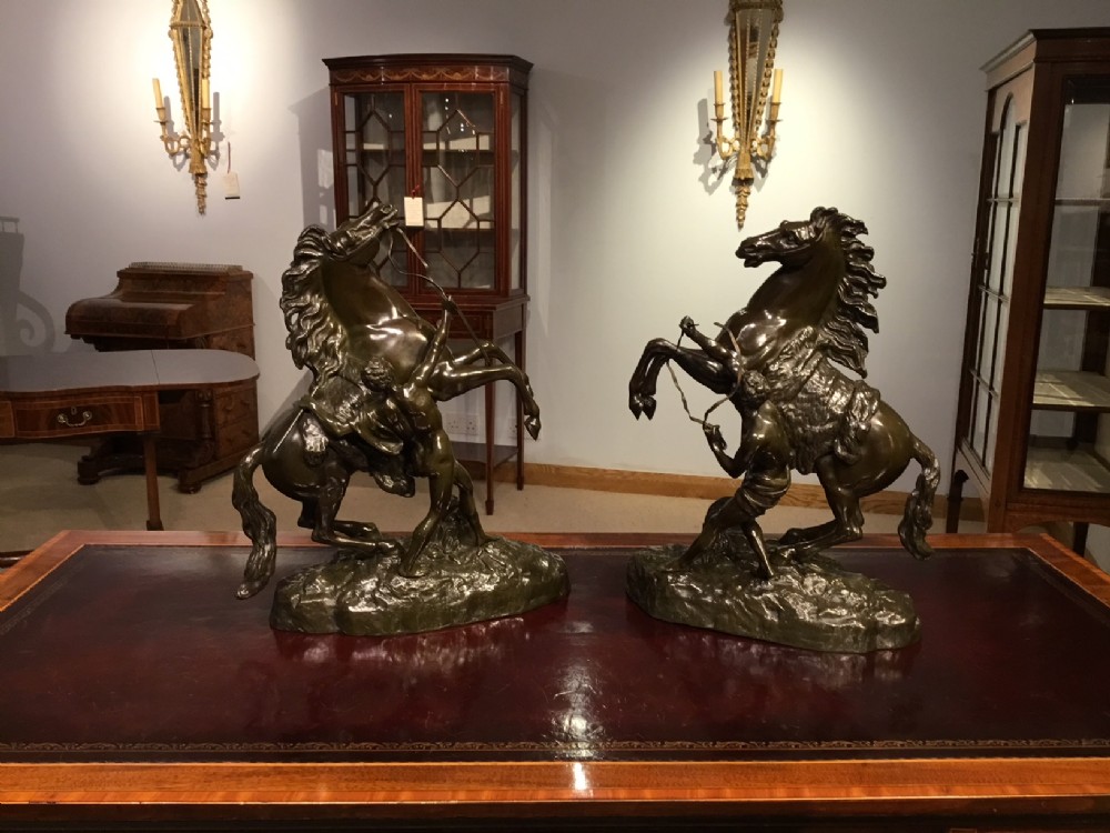 A pair of French Classical 19th Century bronze Marley horses after Coustou 