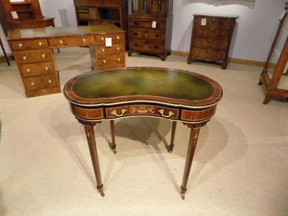 A fine quality rosewood, coromandel & marquetry inlaid Victorian Period kidney shaped writing table