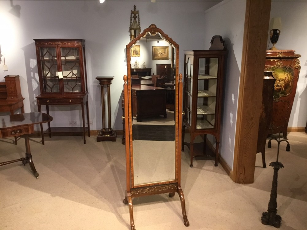 A walnut and parcel gilt Edwardian Period cheval mirror