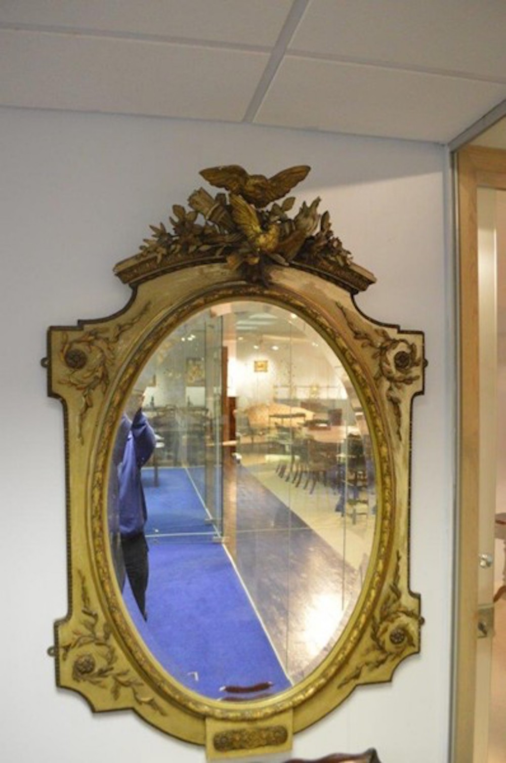 A Carved Gilt Wood French Oval Painted Mirror.