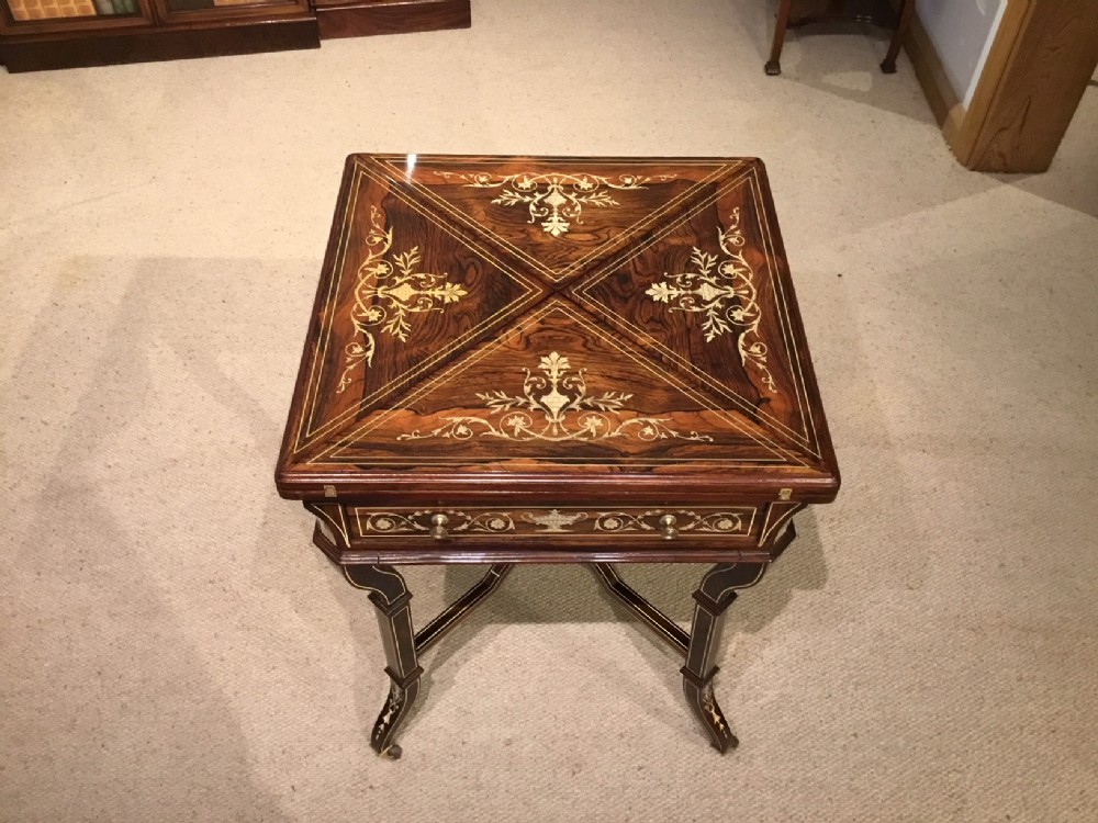 A beautiful rosewood inlaid Late Victorian Period envelope card/games table