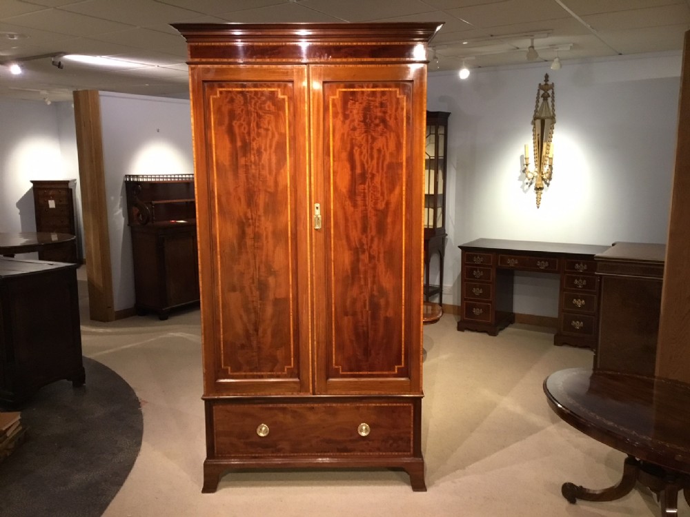 A mahogany inlaid Edwardian Period compactum wardrobe