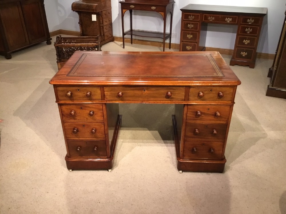 A good mahogany Victorian Period antique pedestal desk.