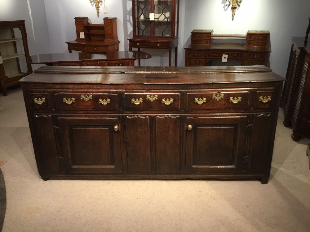 An oak 18th Century antique dresser base.