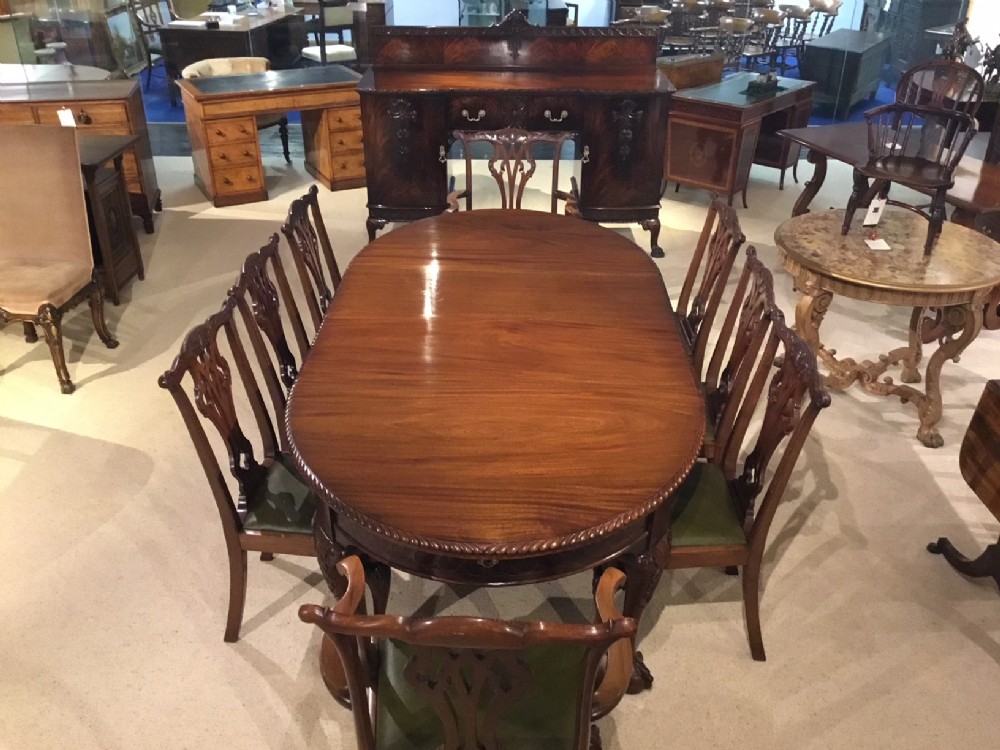 A superb quality mahogany Chippendale Revival dining room suite