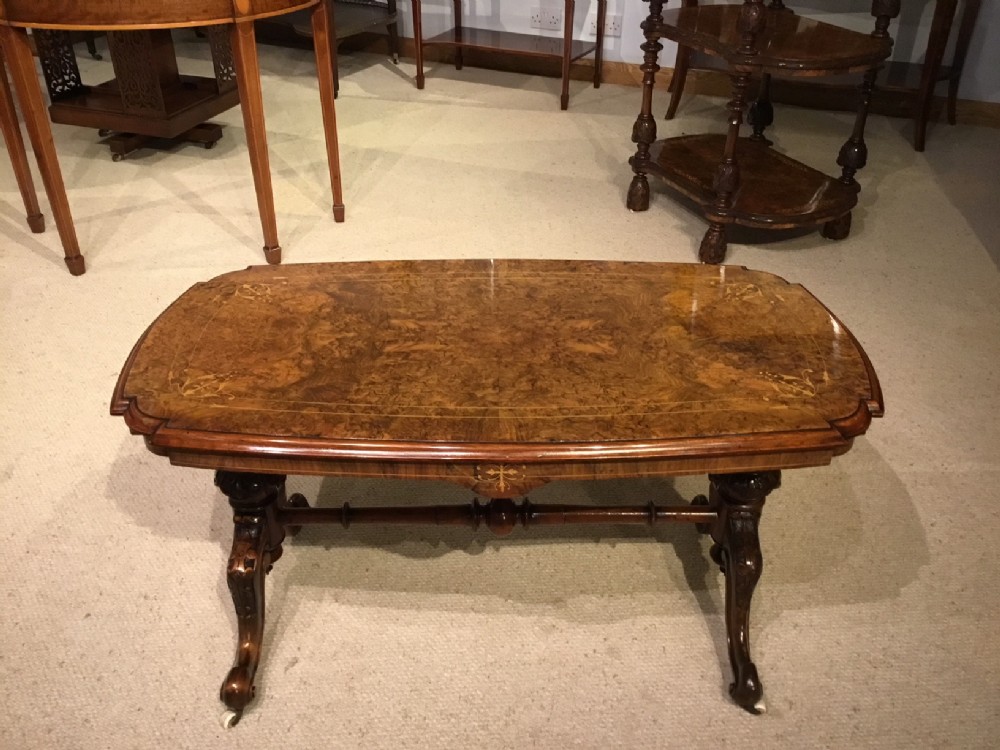 A beautiful burr walnut inlaid Victorian Period antique coffee table.