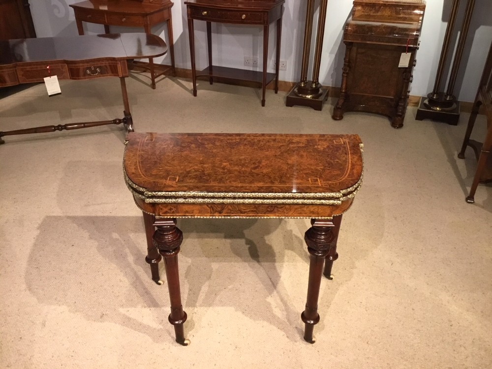 A fine quality burr walnut and ormolu mounted inlaid Victorian Period card/games table. 