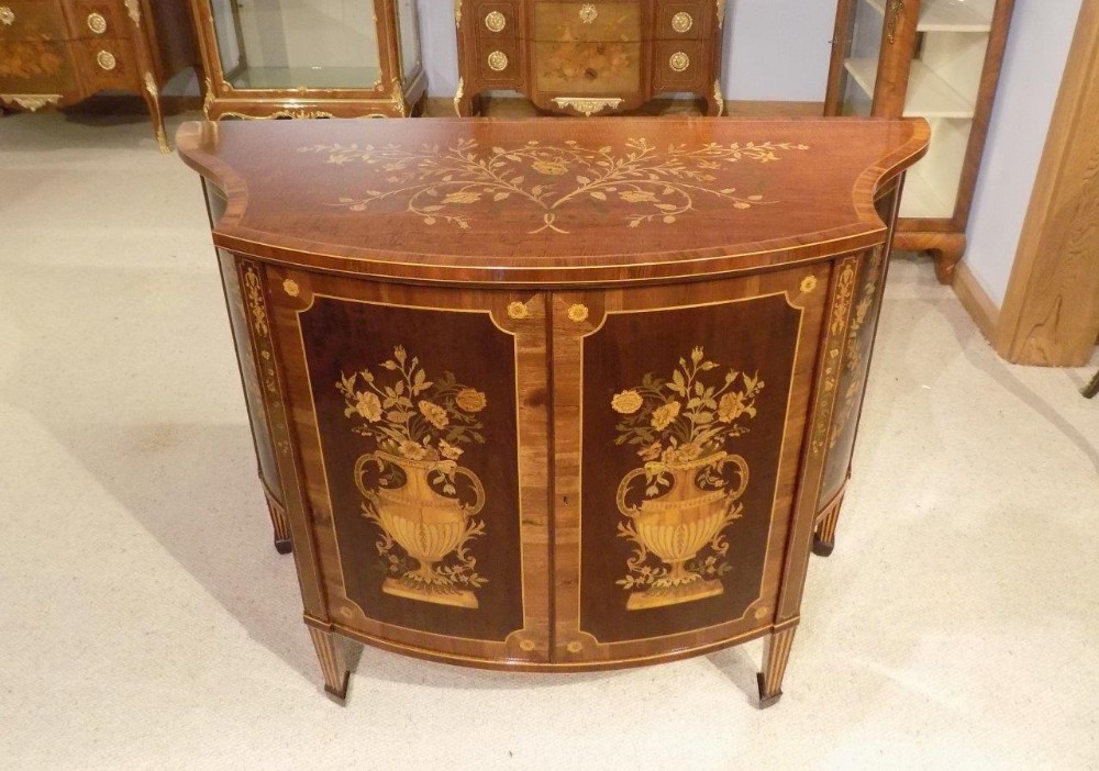 A stunning quality marquetry inlaid Edwards & Roberts serpentine side cabinet