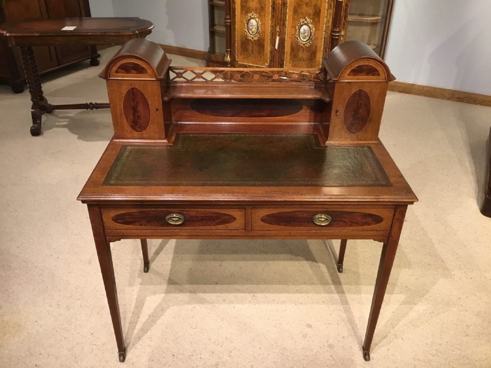 A mahogany inlaid Edwardian Period ladies writing table.