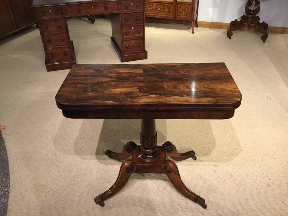 A rosewood Regency Period fold over card table