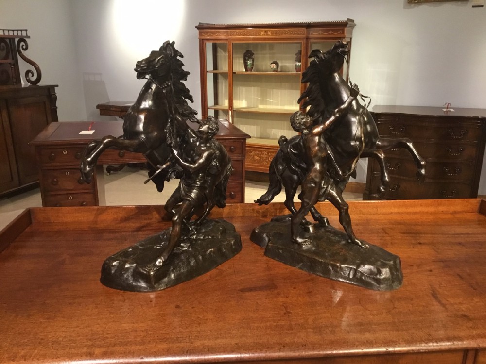 A pair of Classical 19th Century French bronze Marley horses