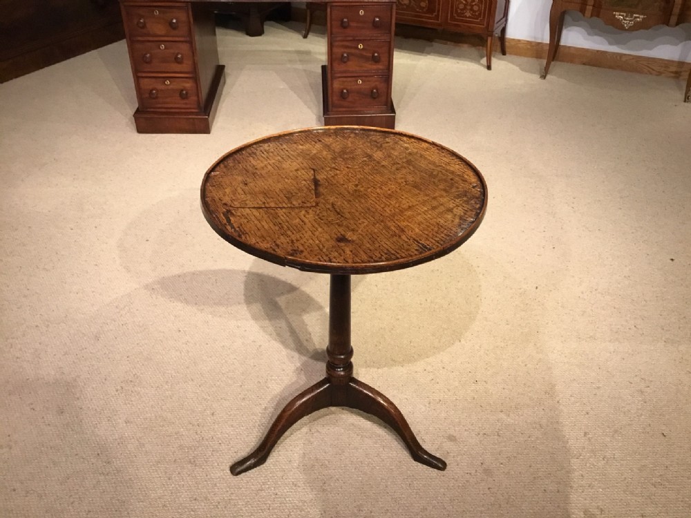 A primitive oak 18th Century tripod table