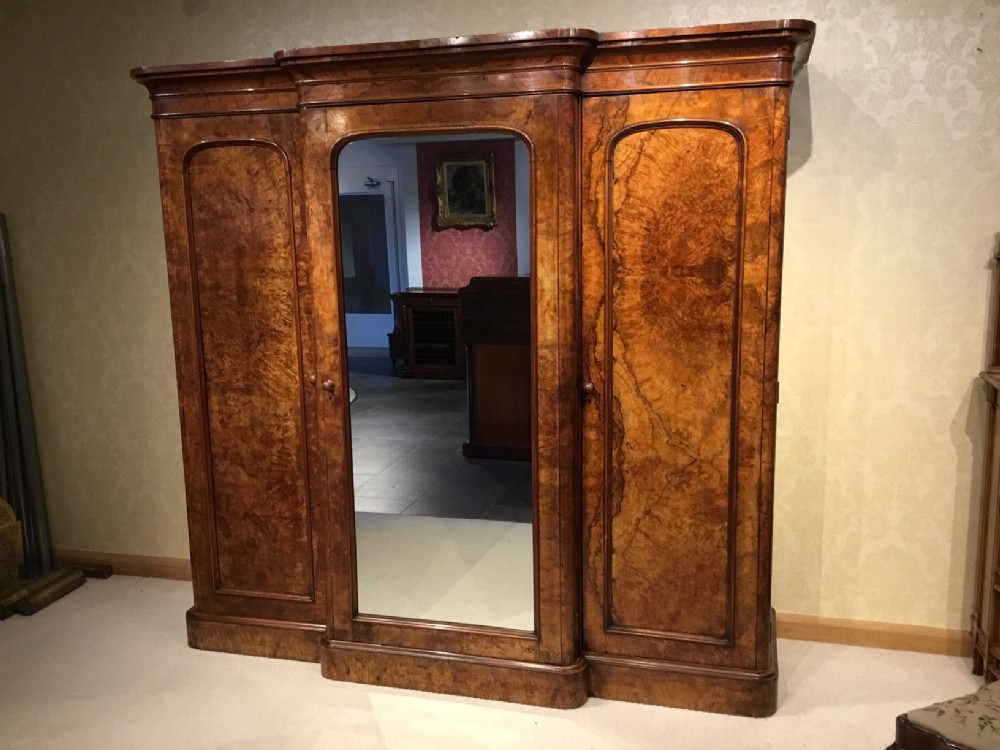A burr walnut Victorian Period breakfront wardrobe