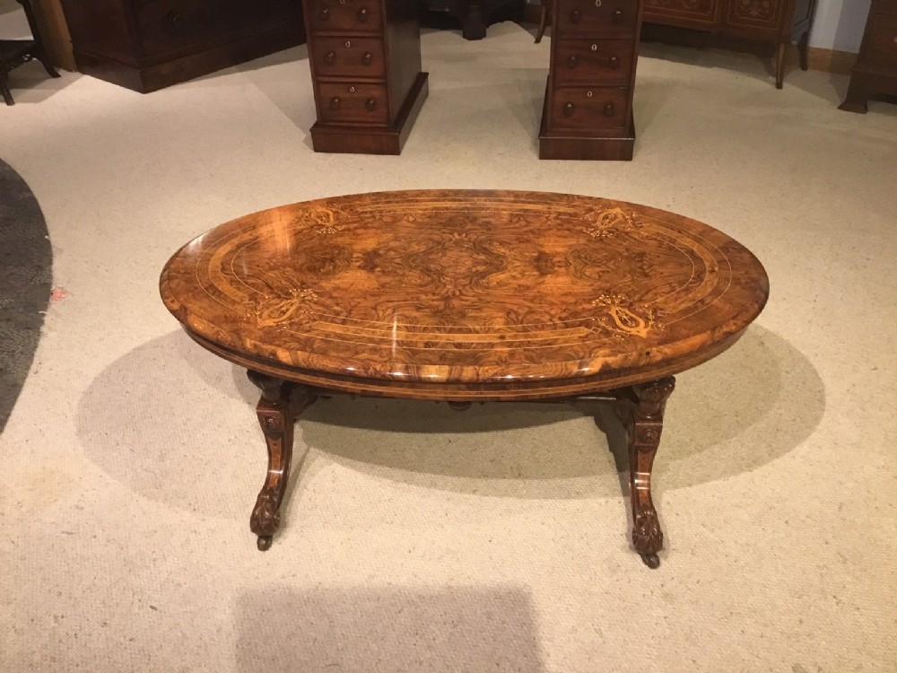 A superb quality burr walnut marquetry inlaid Victorian Period antique coffee table.