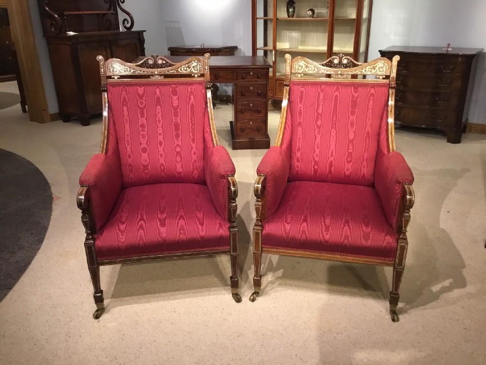 A Superb quality pair of rosewood, ivory & silver inlaid Victorian armchairs.