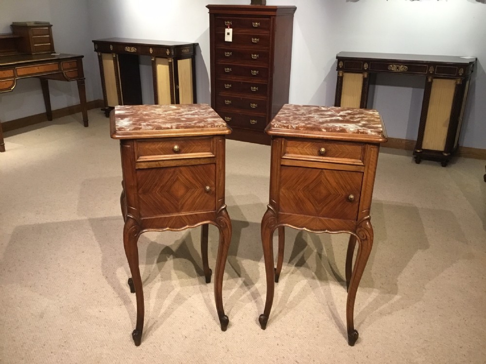 A good pair of walnut marble top French antique bedside cabinets