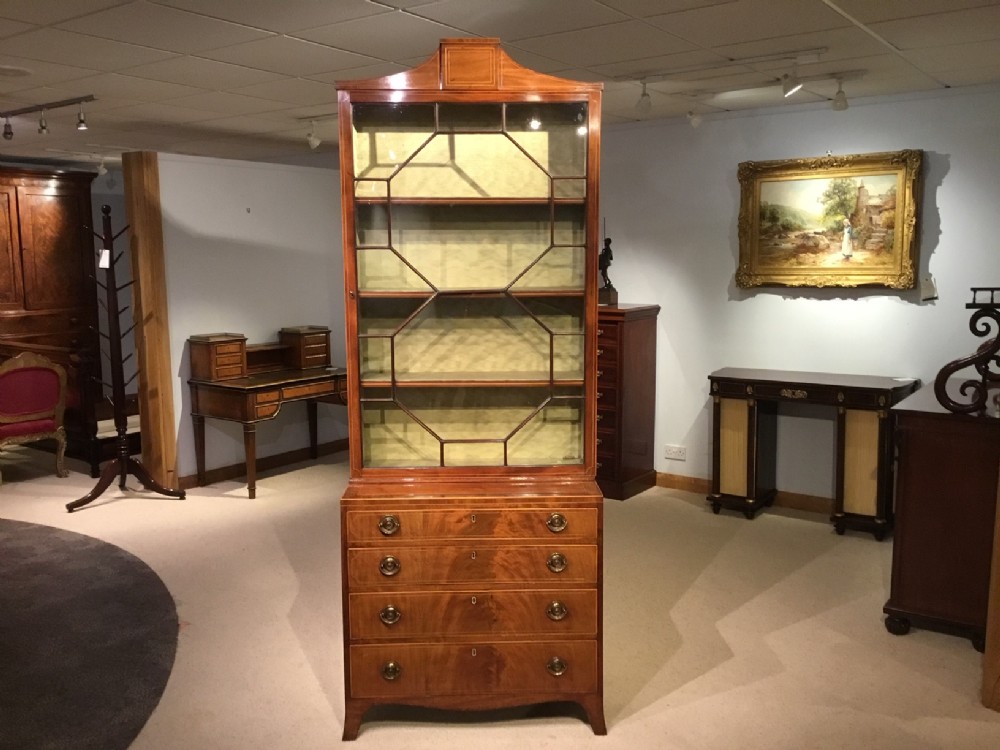 A Flame mahogany George III Style antique cabinet/bookcase. 