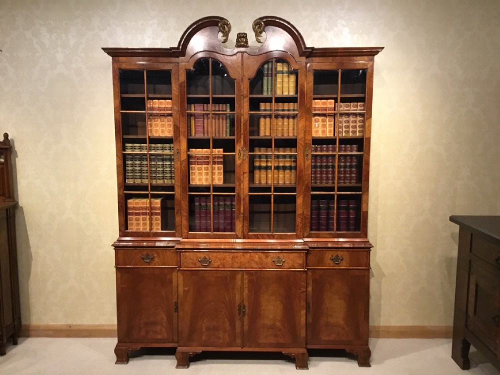A superb figured walnut 1920s Period antique breakfront bookcase.