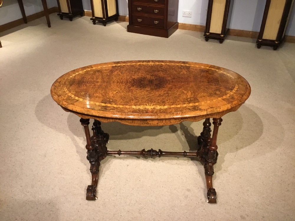 A burr walnut Victorian Period oval occasional table