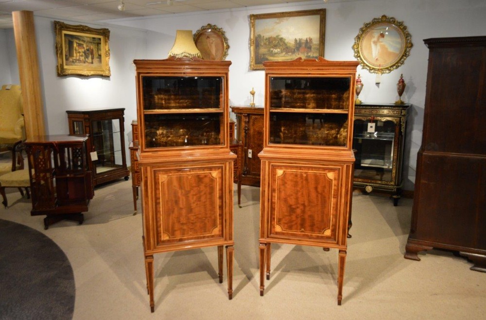 A pair of Edwardian Period fiddleback mahogany inlaid display cabinets.