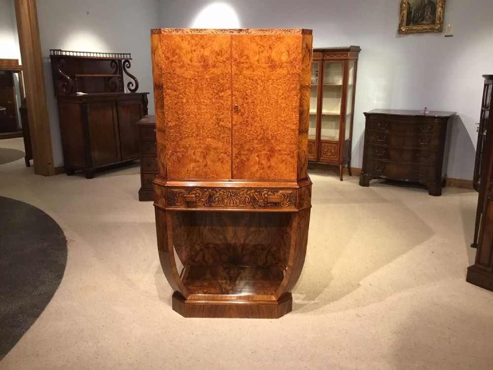 A burr walnut Art Deco Period antique cocktail cabinet.