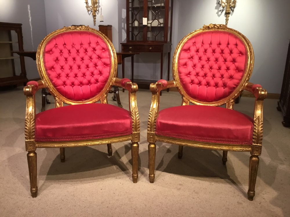 A good pair of  French Louis XVI Style gilt wood carved fauteuils.
